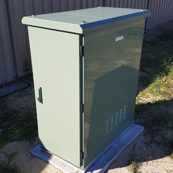 Green NBN Fibre to the Node street cabinet installed outdoors